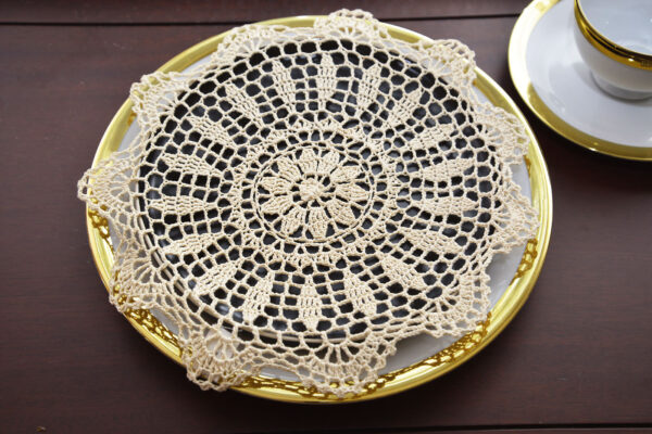 Round crochet doily, wheat color